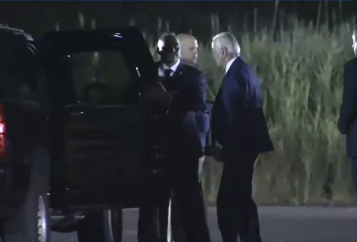 watch:-biden-struggles-to-enter-an-suv-while-secret-service-shields-him-from-cameras
