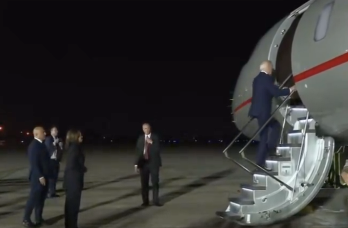 watch:-biden-wanders-off,-boards-an-empty-plane-after-bizarre-photo-op-with-freed-americans