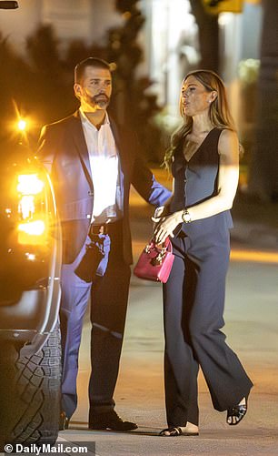 Exclusive DailyMail.com photos show the President-elect's eldest son chivalrously opened the passenger door for her and guided her inside